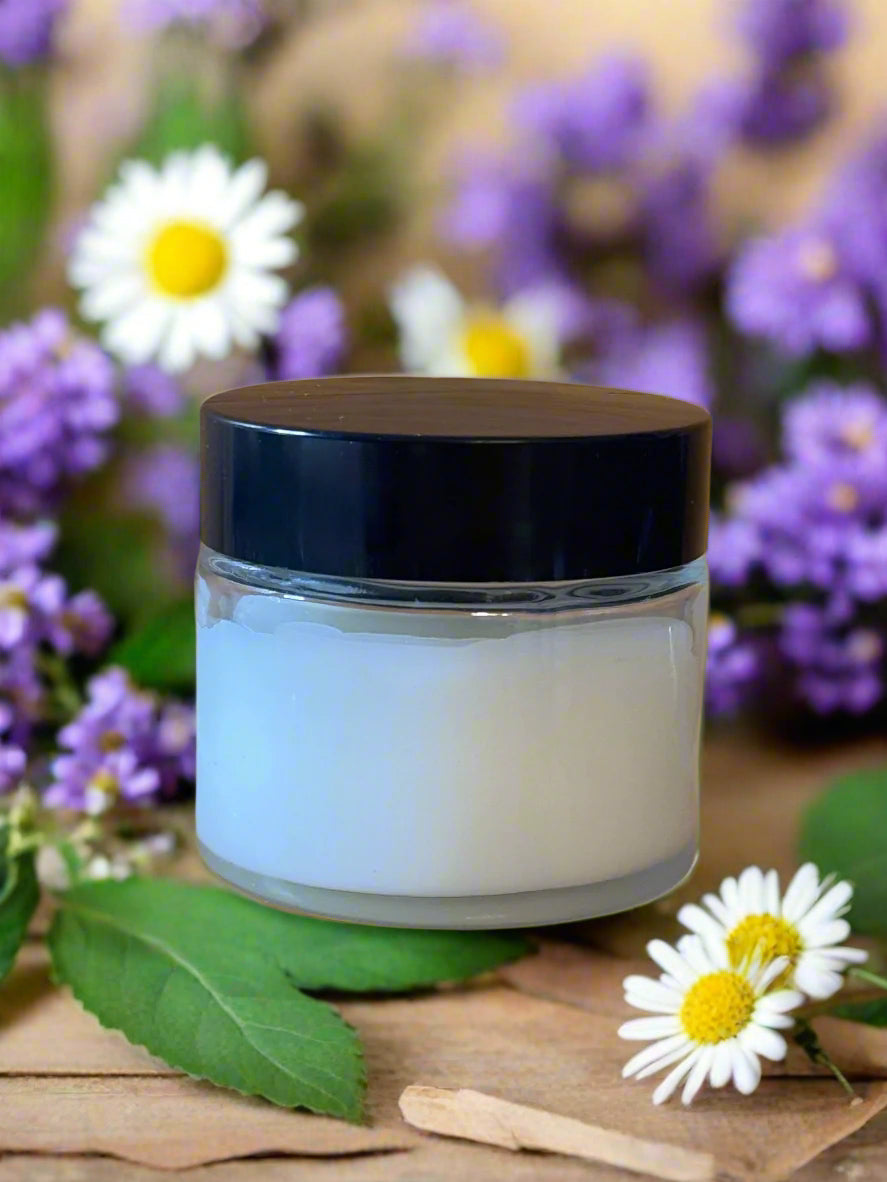Clear jar with headache balm and black lid